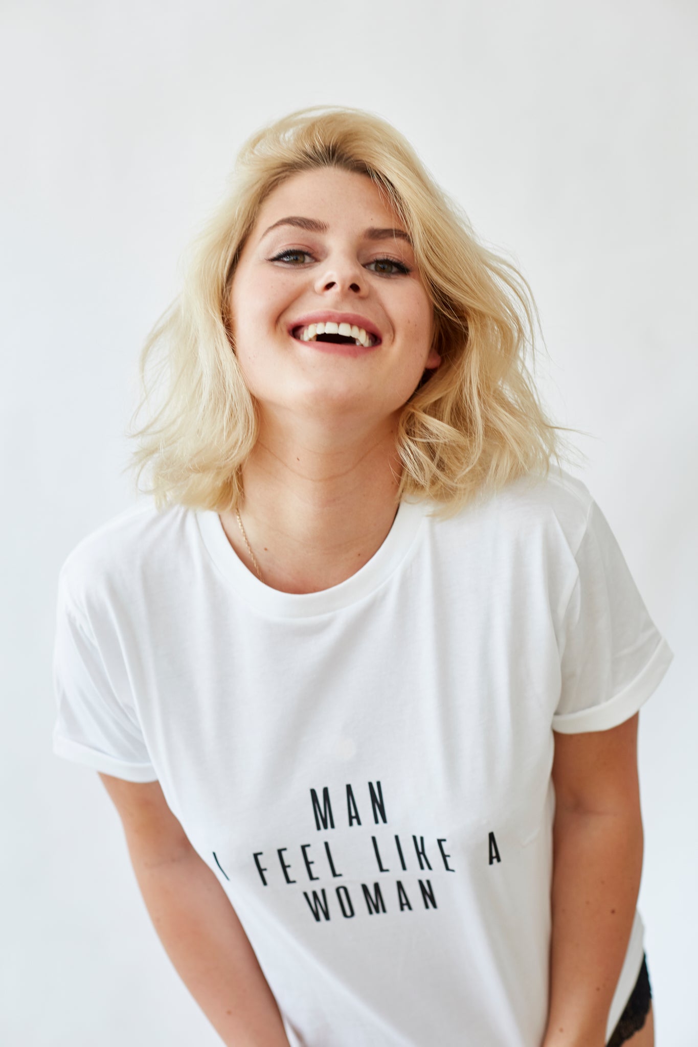 women&#39;s white short-sleeved t-shirt, text reads Man I Feel Like A Woman in black font, sustainably and ethically made