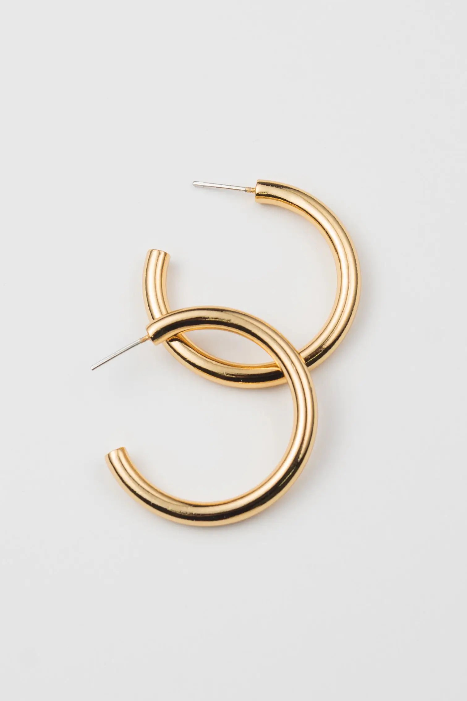 brenda grands jewelry, gold hoop earrings, tube hoops. womens jewelry, fashion jewelry, ethically made, handmade, sustainable fashion, curate