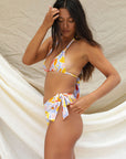 stone fox swim, triangle bikini top, floral print, pastel colors, blue, pink, red, orange and yellow, sustainable and ethical swimwear